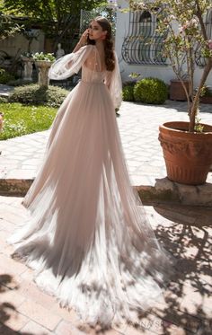 a woman in a wedding dress is talking on the phone