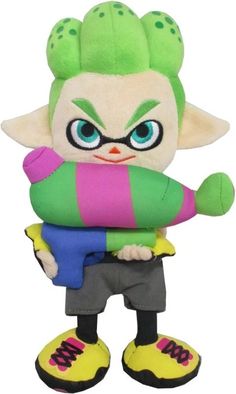 a stuffed toy that looks like it is holding something in his hands and wearing green, pink