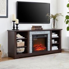 a living room with a fireplace and television mounted on the wall, in front of a large flat screen tv