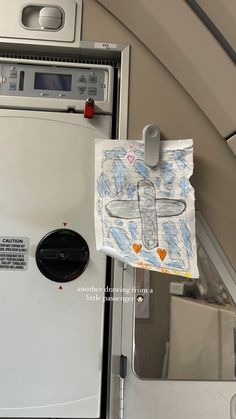 a white refrigerator freezer sitting inside of a kitchen next to a wall mounted oven