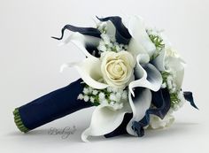 a bridal bouquet with white flowers and blue ribbon on the end is shown in front of a white background