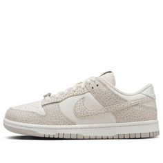 The Nike Dunk Low 'Safari Phantom' is a must-have for your collection. This women's exclusive features a premium leather upper with a subtle twist. The classic white base gets a wild makeover with overlay panels boasting a safari-inspired print in neutral tones of grey and beige. The look is grounded by a light smoke grey Swoosh and a clean white midsole. Don't miss your chance to own a piece of Nike Dunk history with a touch of safari flair! Nike Luxury Leather Sneakers, Nike Dunks Low, Dunks Low, Limited Edition Sneakers, Nike Dunk Low, Grey And Beige, Womens Size Chart, Dunk Low, Sport Sneakers