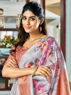 Elevate your ethnic wear collection with our charming grey floral printed silk festival wear saree with blouse. This stunning saree features a beautiful lavender color silk material adorned with floral print work and intricate zari weaving work.
The peach color silk material blouse also showcases delicate zari weaving work, adding a touch of elegance to the ensemble. The traditional silk fabric of the saree ensures a comfortable drape, making it perfect for any festive occasion.
This saree inclu Gray Saree With Pallu, Gray Saree For Diwali, Silk Printed Saree, Cultural Celebration, Art Silk Sarees, Grey Art, Printed Saree, Wear Saree, Peach Color