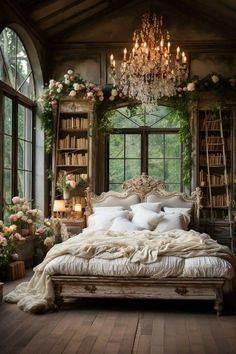 a large bed sitting under a chandelier in a bedroom next to a window