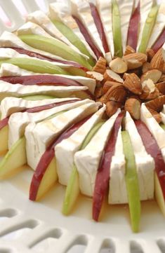 an apple and cheese dessert with nuts on top