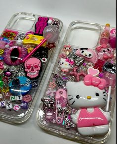 two cell phones with hello kitty cases on them