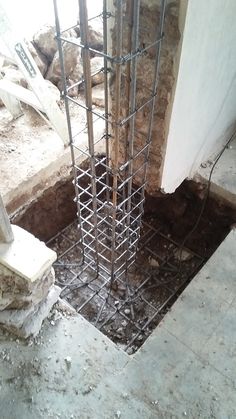 a concrete slab is being constructed in the corner of a room