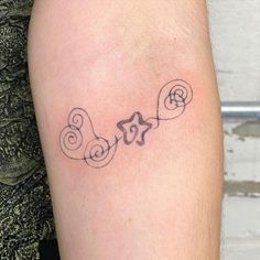 a small tattoo on the leg of a woman