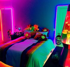 a bedroom with neon lights and colorful bedding