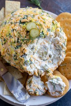 a white plate topped with cheese and crackers