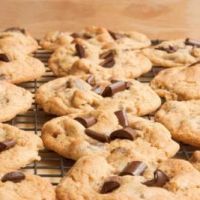 chocolate chip cookies on a cooling rack ready to be baked in the oven for consumption