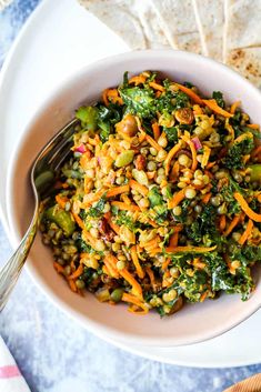 a white bowl filled with carrot lentil salad