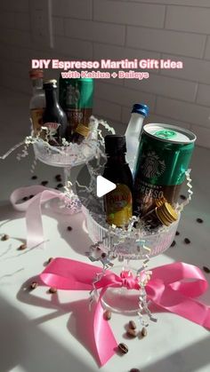 a glass bowl filled with assorted drinks and confetti