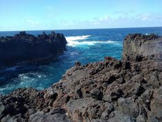 some rocks and water near the shore