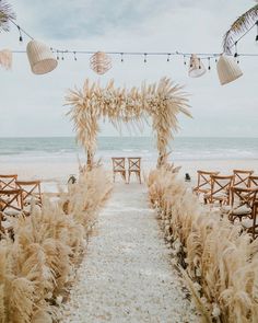 an outdoor ceremony set up on the beach