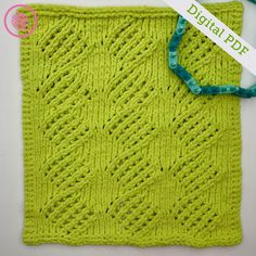 a green knitted square with a ribbon around it's edge and the text, digital