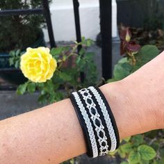 Traditional Sami inspired cuffs, with the softest reindeer leather and three braids of pewter and silver threads (middle with sterling silver beads).  The border braids with 3 wave pewter / silver braids. Middle row with sterling silver beads. These braids are hand sewn on. The clasp is a magnetic clasp as a standard, but can be made with shed antler button or pewter button. The width of these are a standard of 3cm, but can be made with larger or smaller widths. any changes to the standard, plea Braided Silver Leather Jewelry, Silver Braided Leather Jewelry, Silver Braided Bohemian Bracelets, Bohemian Silver Braided Bracelet, Handmade Silver Leather Braided Bracelets, Silver Braids, Three Braids, Antler Buttons, Micro Macrame