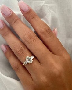 a woman's hand with a ring on it