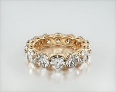 a gold ring with three rows of diamonds