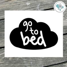 the word go to bed on top of a black cloud with white letters in it