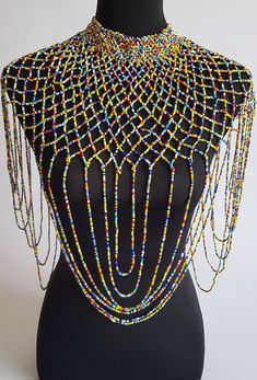 "This shoulder necklace is 100% handmade. Perfect for weddings , African themed events, cultural events or any other event. The list is endless.... Color; multicolor. Size; 22\" long for the longest strand. 16\" around the neck. **Buy multiple items and pay shipping for 1 item only.The rest ships free. More neckleces here; https://www.etsy.com/shop/TribalTess?ref=seller-platform-mcnav&section_id=21306083 Back to my shop; https://www.etsy.com/shop/TribalTess?ref=seller-platform-mcnav" Wedding Multicolor Beaded Chain Beads, Multicolor Beaded Chain Necklace For Wedding, Multicolor Beaded Necklace For Wedding, Rainbow Beaded Necklaces For Party, Handmade Multicolor Bridal Necklace With Round Beads, Unique Multicolor Beaded Necklaces For Celebrations, Multicolor Beaded Bridal Necklace For Party, Bohemian Multicolor Bridal Necklace With Round Beads, Traditional Colorful Beads Bib Necklace For Party