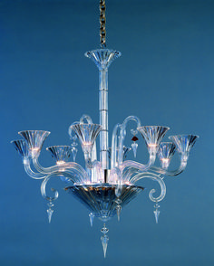 a glass chandelier hanging from the ceiling