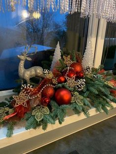 a window sill decorated with christmas decorations