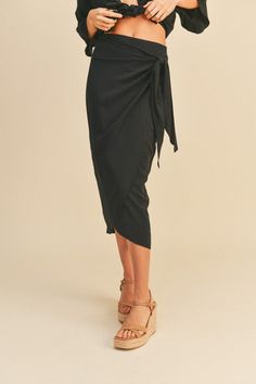 A gorgeous rayon wrap skirt that will match most tops in your closet. Easy to style. * * Size & Fit Model is wearing size S Measurements taken from size S Height - 5' 7 1/2" / 175.3CM 33(Bust) - 24(Waist) - 34(Hips) Black Wrap Skirt, Cute Crop Top, Cute Crop Tops, Boutique Design, Professional Look, Comfy Tees, Black Skirt, Strappy Heels, Wrap Skirt