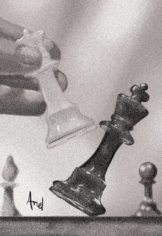 a hand holding a glass bell next to chess pieces