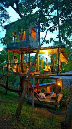 the tree house is lit up at night