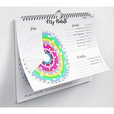 a spiral notebook with a calendar on it