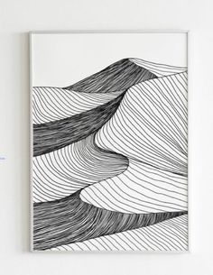 a black and white drawing with wavy lines on the paper, framed in a white frame