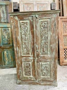 an old wooden armoire with carvings on it