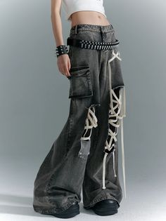 The Gothic Punk Wide-Leg Jeans are distressed gray denim jeans featuring lace-up accents and cargo pockets. These wide-leg jeans combine the edgy appeal of punk fashion with gothic elements, creating a bold and fashionable look. The distressed detailing adds a rugged touch, while the lace-up accents provide unique, statement-making details. The cargo pockets add functionality and style. Model's measurements: Height 166cm, Bust 79cm, Waist 60cm, Hip 86cm, wearing size S. Gothic Punk, Grey Denim, Fashion Design Clothes, Really Cute Outfits, High Waisted Denim, Punk Fashion, Look Cool, Wide Leg Jeans, Denim Pants