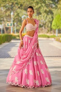 Pink applique hand embroidered lehenga and dupatta with pearl embellished blouse.From Vvani Vats Gul Spring Summer's collection.DELIVERY TIMEPlease allow 8-12 weeks for your outfit to arrive.FABRIC DETAILSLehanga - Organza, Dupatta - Organza, Blouse - GeorgetteProfessional cleaning only. Flower Lehenga, Pink Organza Lehenga, Pearl Blouse, Appliqué Flowers, Pearl Border, Pearl Tassels, Indian Dress Up, Cut Blouse