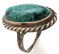 Vintage Gemstone Jewelry - This is a handmade sterling silver ring with a green turquoise stone. It is a size 6.5, hallmarked Sterling, face measures 1" by .63", weighs 7.4 grams, some tarnish. Vintage Green Turquoise Cabochon Ring, Oval Green Chrysocolla Rings, Green Turquoise Ring With Patina In Sterling Silver, Antique Green Turquoise Ring As Gift, Green Sterling Silver Ring With Patina, Green Rings With Patina, Green Oval Ring With Patina, Vintage Green Turquoise Ring Stamped 925, Handmade Sterling Silver Rings