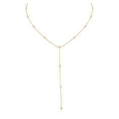 This is part of Chairish’s Fine Jewelry assortment.  1 Carat Diamond Lariat Necklace in 18K Gold studded with round cut diamond. This stunning piece of jewelry instantly elevates a casual look or dressy outfit.  April birthstone diamond brings love, fame, success and prosperity. Designed with bezel set diamonds studded in a lariat necklace making a stunning delicate necklace. This beautiful handcrafted necklace is a perfect Unique Gift, Bridal Shower Gift, Secret Santa Gift, Gift For Sister, Mot Fine Jewelry Diamond White Lariat Diamond Necklace, Fine Jewelry Lariat Necklace In Diamond White, Fine Jewelry Diamond Lariat Drop Necklace, Lariat Necklace With Diamond Accents, Fine Jewelry Diamond Lariat Backdrop Necklace, Diamond Lariat Backdrop Necklace In Fine Jewelry Style, Fine Jewelry Lariat Backdrop Necklace With Diamond Accents, Diamond Lariat Necklace With Diamond Cut, Diamond Lariat Necklace With Clavicle Chain