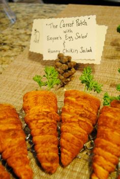 some carrots are on a table with other food items