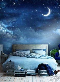 a bed room with a neatly made bed and a night sky mural