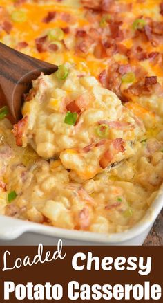 loaded cheesy potato casserole in a white dish with a wooden spoon