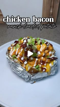 chicken bacon ranch baked potato on a white plate