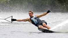 a man riding skis on top of a body of water