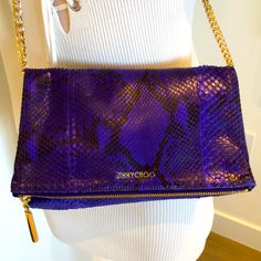 100% Authentic Jimmy Choo Fold Over Clutch Gorgeous Genuine Snake Skin . Violet And Black . I Wanted It To Be More Than A Clutch. I Added A Chain Amd It Worked . Doesn’t Come With A Chain But I Can Include The Chain. Never Worn. Perfect Inside No Stains Like New Condition 10”X7” Jimmy Choo Bags, Fold Over Clutch, Jimmy Choo Bag, Fold Over, Snake Skin, Jimmy Choo, Violet, The 100, Bag Lady