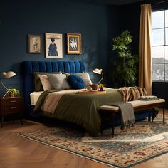 a bed room with a neatly made bed next to a window and a rug on the floor