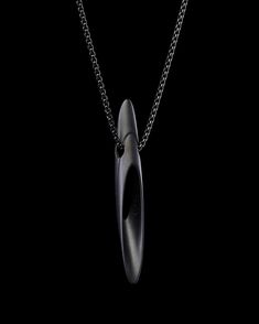 The Kunai pendant in matte black is accompanied by a 2mm rounded box chain. Stylized sci-fi design look with brand engraving. Modern Matte Black Jewelry As A Gift, Modern Matte Black Jewelry As Gift, Modern Matte Black Jewelry For Gifts, Minimalist Black Matte Finish Jewelry, Black Matte Finish Jewelry Gift, Edgy Black Necklace For Cosplay, Luxury Black Symbolic Necklace, Modern Black Necklace With Oxidized Finish, Edgy Black Stainless Steel Necklace