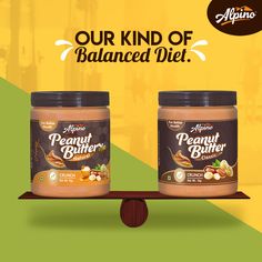 two jars of peanut butter sitting on top of a wooden balancer with the words our kind of balanced diet