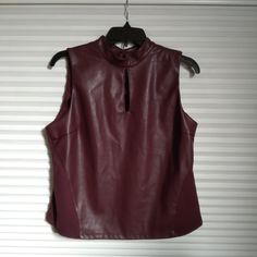 Brand: Marc New York Top. New With Tag Faux Leather Front, Soft And Stretchy Fabric Back, Soft/Stretchy & Washable. Mock Neck With Keyhole Keyhole In The Back With Button Closure Sleeveless Size-M Burgundy Color. Sleeveless Faux Leather Top For Night Out, Fitted Sleeveless Faux Leather Top, New York Top, Marc New York, Burgundy Color, Leather Top, Stretchy Fabric, Mock Neck, Sleeveless Top