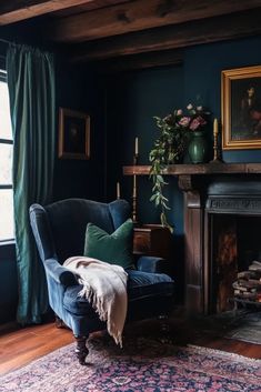 a living room filled with furniture and a fire place in front of a painting on the wall