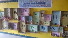 there are many letters and numbers on the wall in this classroom display that is made out of cardboard boxes