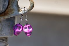 Purple skull bead on a silver earring. Adjustable Skull-shaped Earrings With Ear Wire, Adjustable Skull Shaped Earrings With Ear Wire, Handmade Sterling Silver Skull Earrings, Purple Skull, Eagle Mountain, Bead Earring, Angel Earrings, Beaded Skull, Skull Earrings